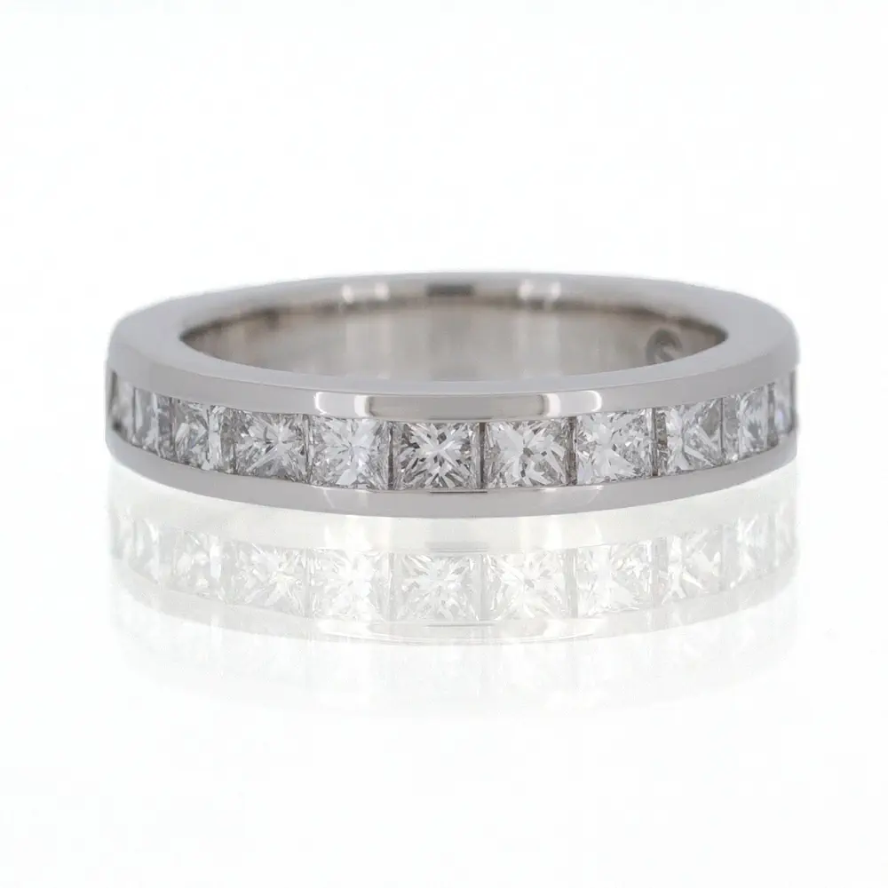 A princess cut diamond eternity ring in white gold.